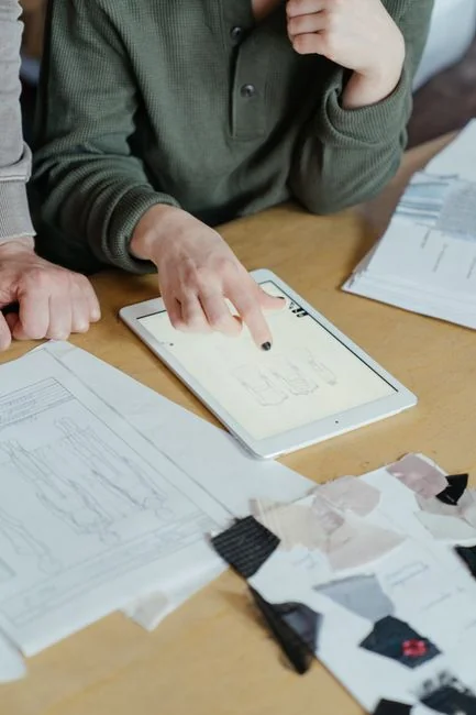A contemporary workspace showcasing a laptop, tablet, and smartphones, ideal for tech and freelance use.